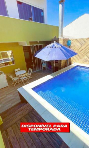 Casa próxima a praia com piscina!